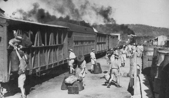 October 1942 - Adelaide River troop train showing converted catle cars and passenger car on North Australia Railway
