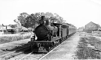 late 1930s - loco SAR Rx200 + train in station yard - North Line