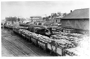 ,loco SAR K68 shunting wagons in yard - good shed - Port Dock - Searcy Collection