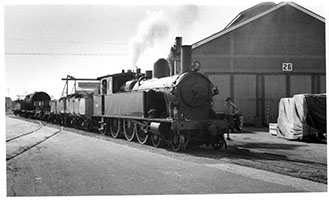 4.1964 - loco SAR F180 + goods wagons - Islington Works - D Worth Collection
