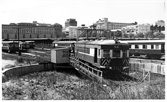 2.1964, railcar brill No. 56 on turntable - railcar depot + view of station - Adelaide