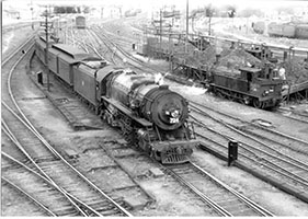c.1951,loco SAR 724 on passenger train in yard - loco F242 coaling - Adelaide
